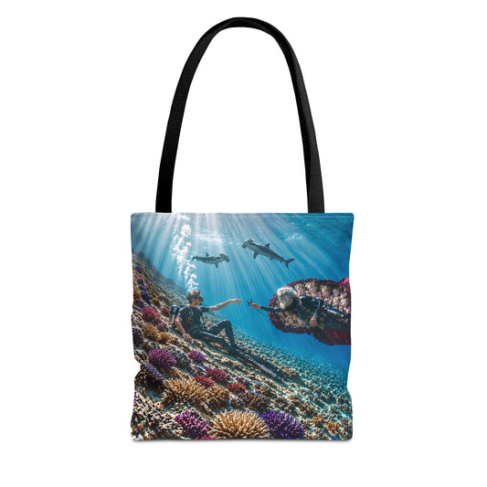 Tote bag with an underwater scene of people and sharks on a white background